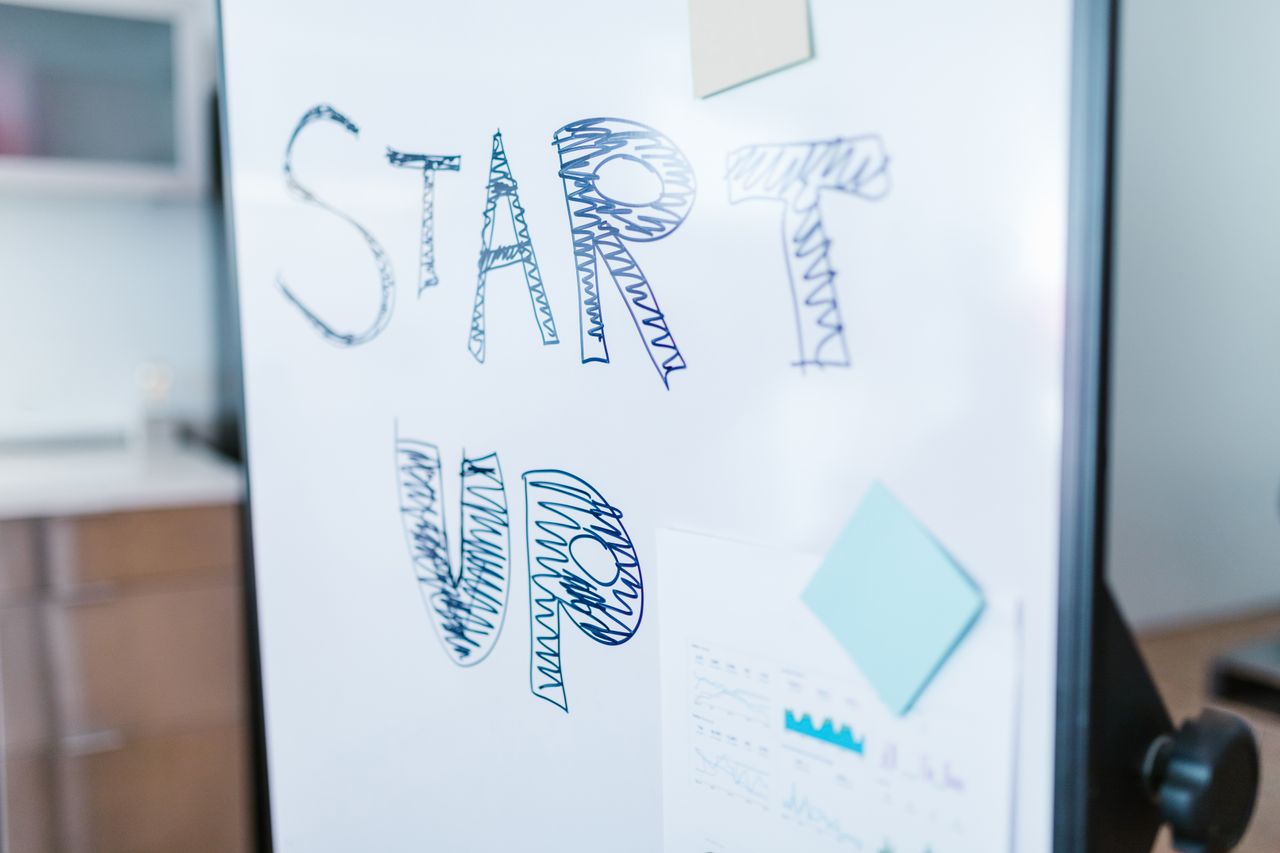 Creative startup concept handwritten on a whiteboard, symbolising innovation in business.
